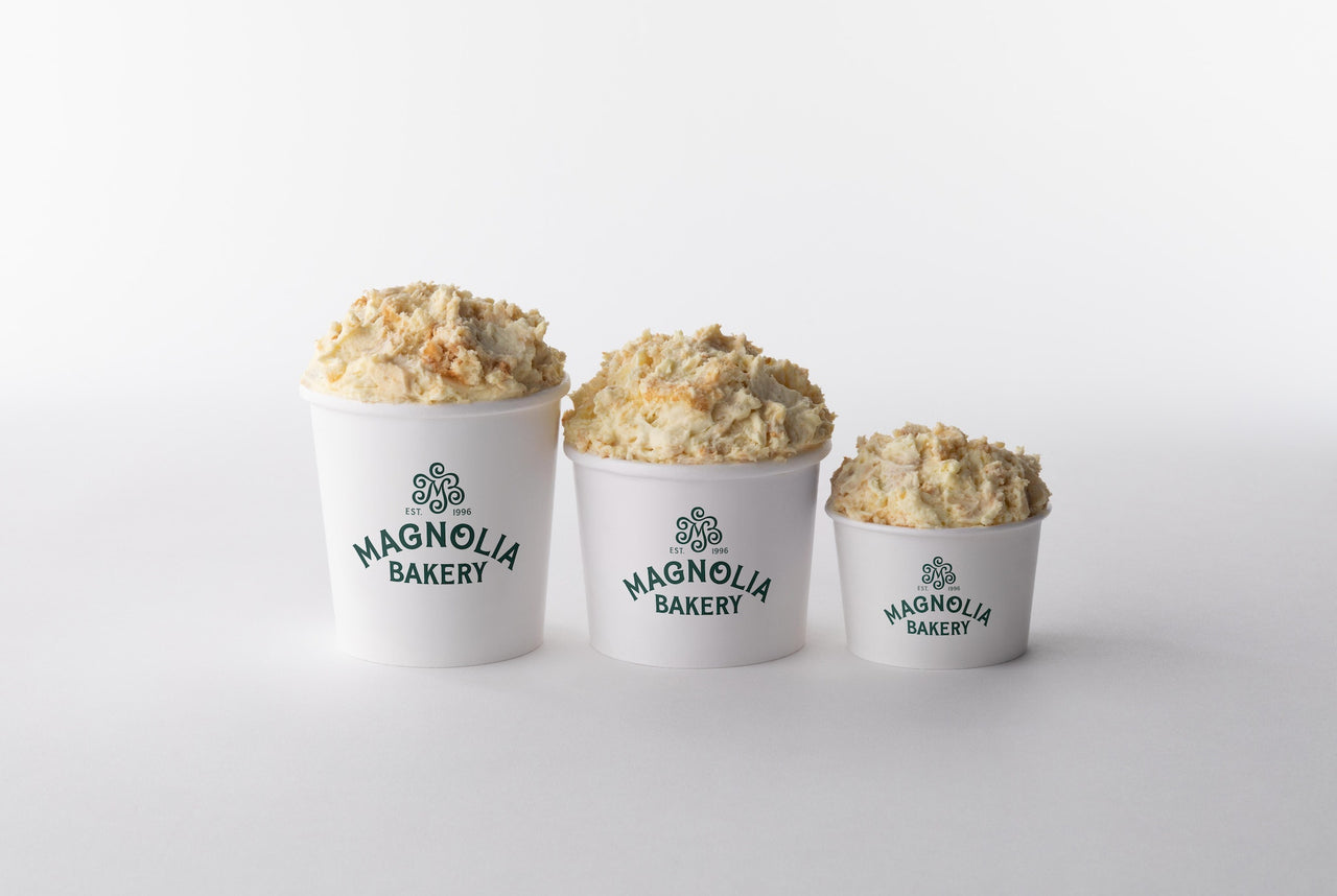 Three sizes of Magnolia Bakery banana pudding arranged against a white background