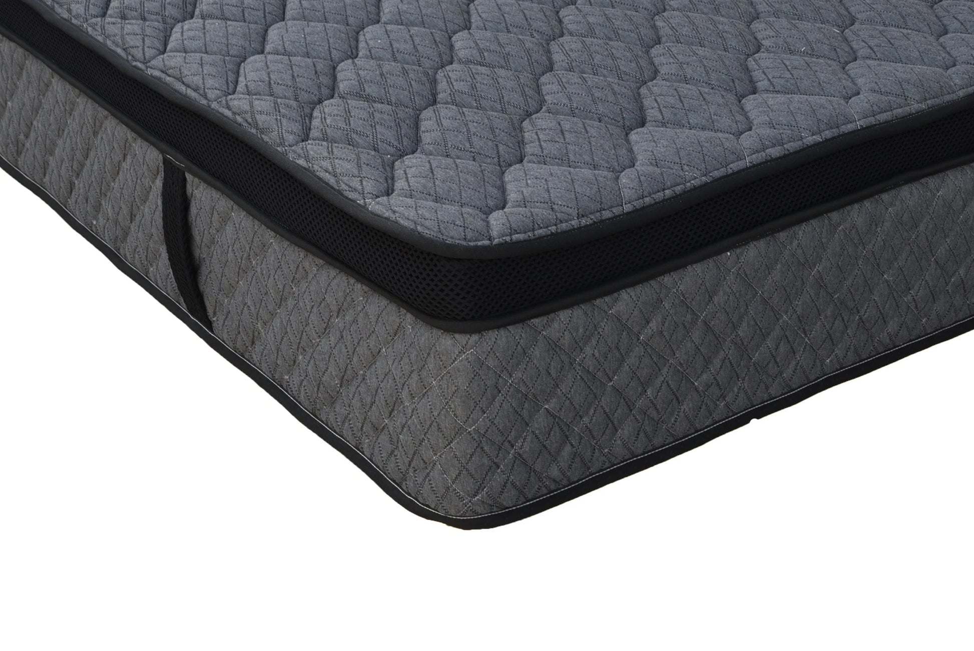 Close view of a dark grey quilted firm mattress with contrasting black edging