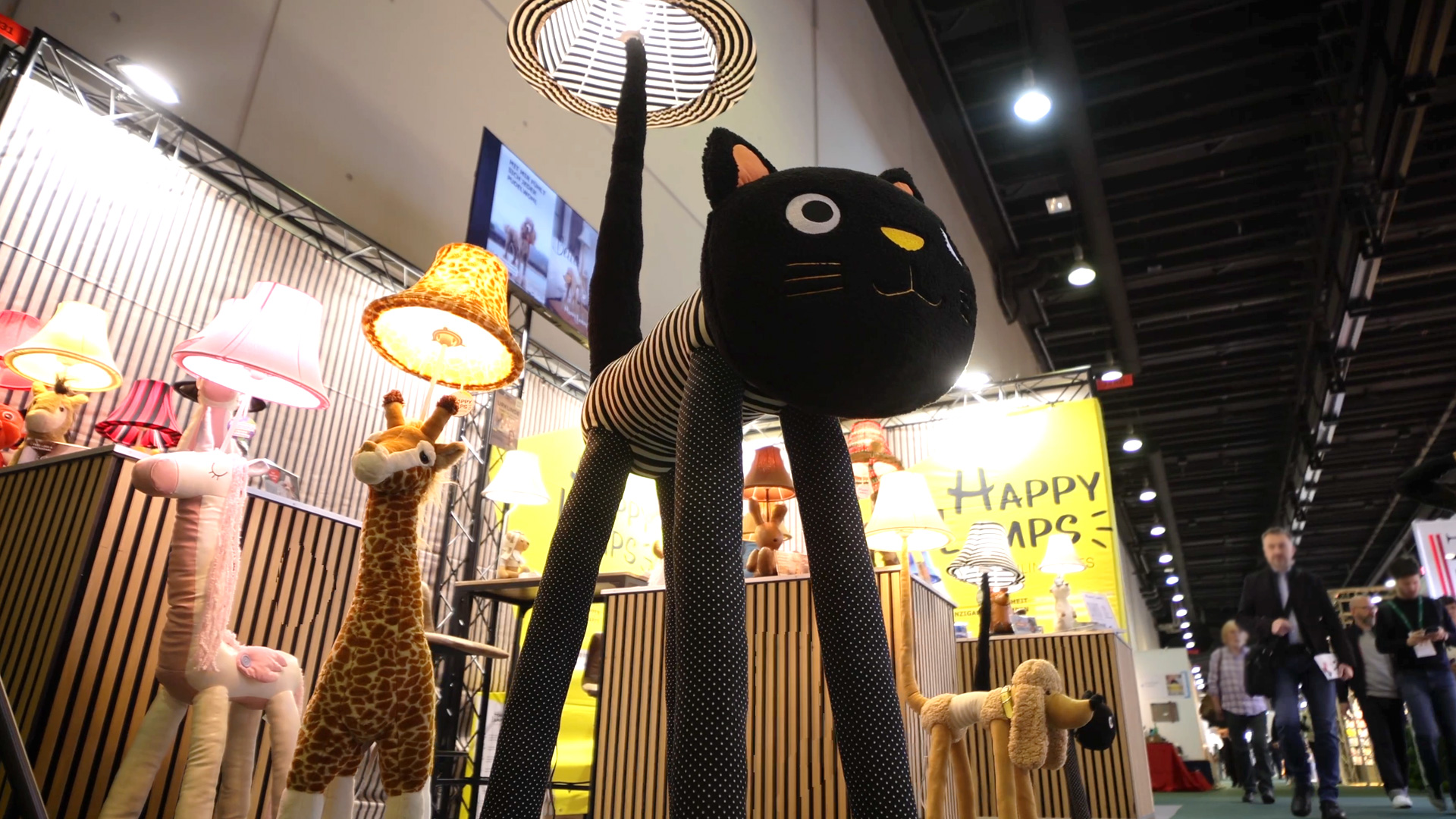 Animal-shaped Happy Lamps floor lamps displayed at a trade show booth