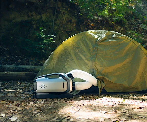 ZERO BREEZE portable air conditioner by a camping tent