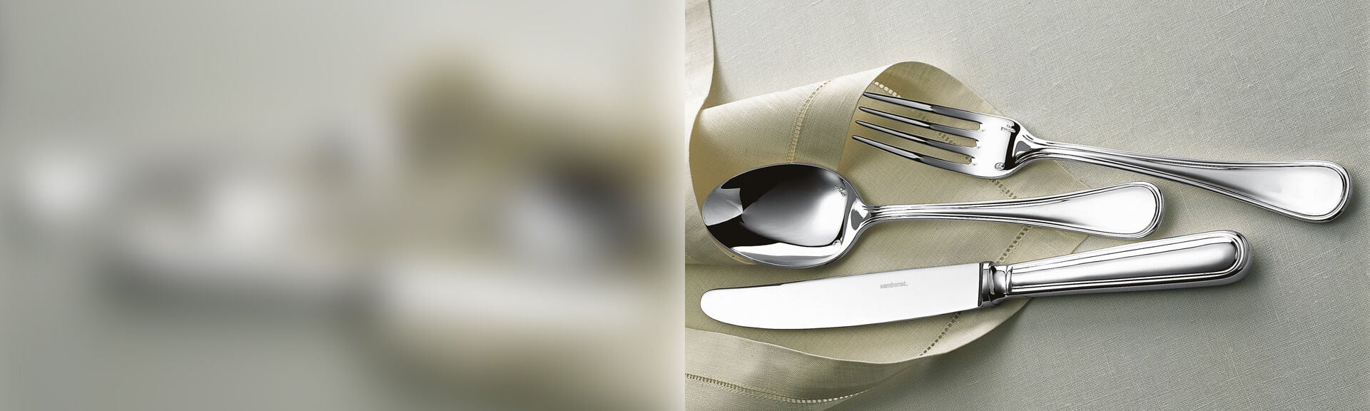 Sambonet Contour cutlery arranged on folded white table linens