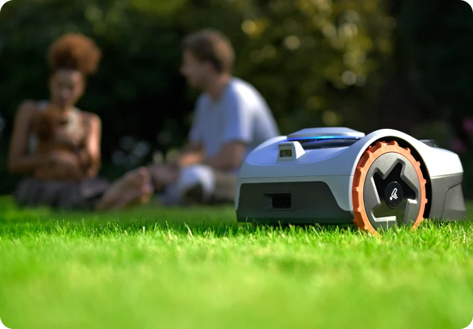 Navimow robotic lawnmower operating on a garden lawn