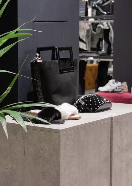 Designer handbags and accessories displayed inside a CSD London store