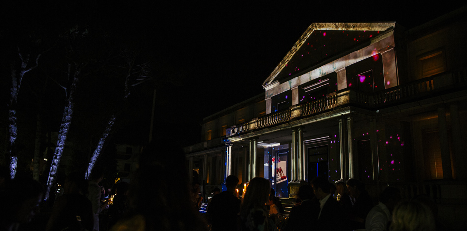 Guests gathered outside a Julian Fashion boutique during an evening event