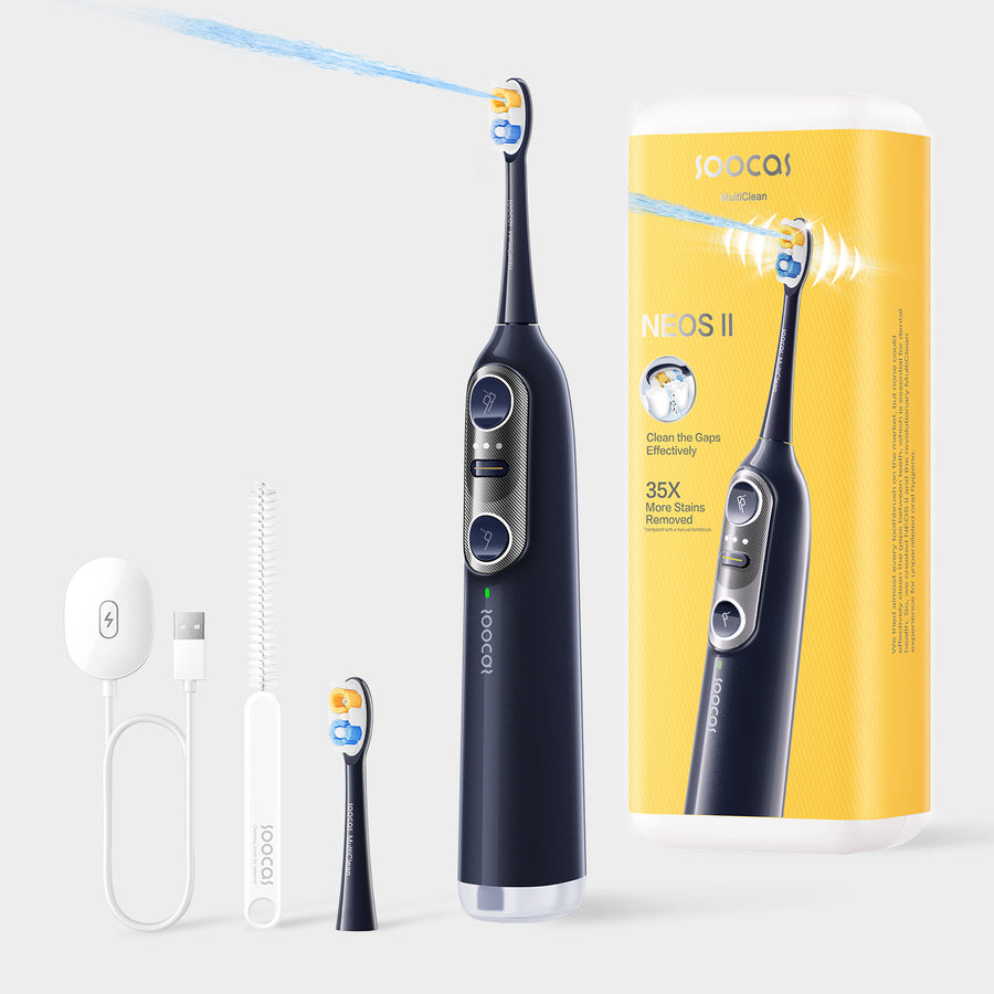Black Soocas NEOS II electric toothbrush and accessories beside its retail box