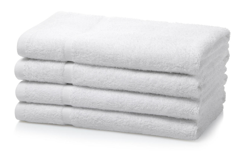 A neat stack of five folded white hotel hand towels on a white background