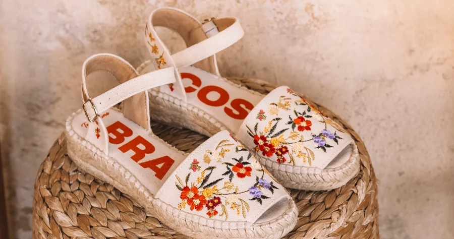 Toni Pons espadrilles arranged on a woven basket