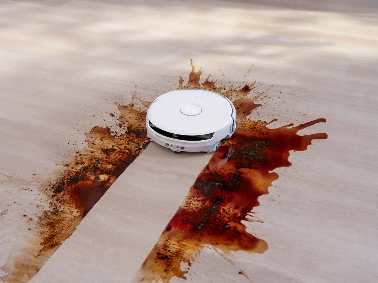 Narwal robot vacuum and mop cleaning a hard floor