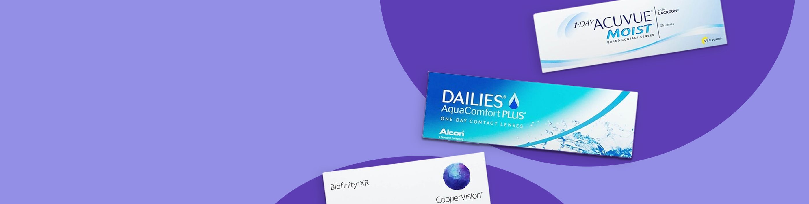 Three boxes of daily contact lenses arranged on a purple studio background