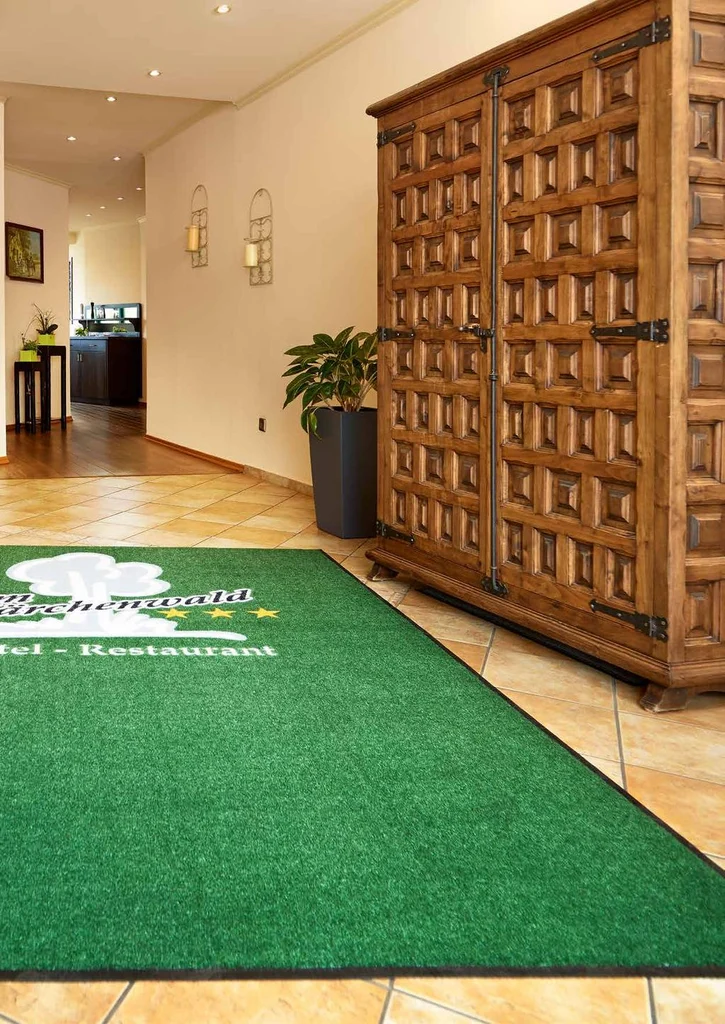 Logo entrance mat in a business lobby