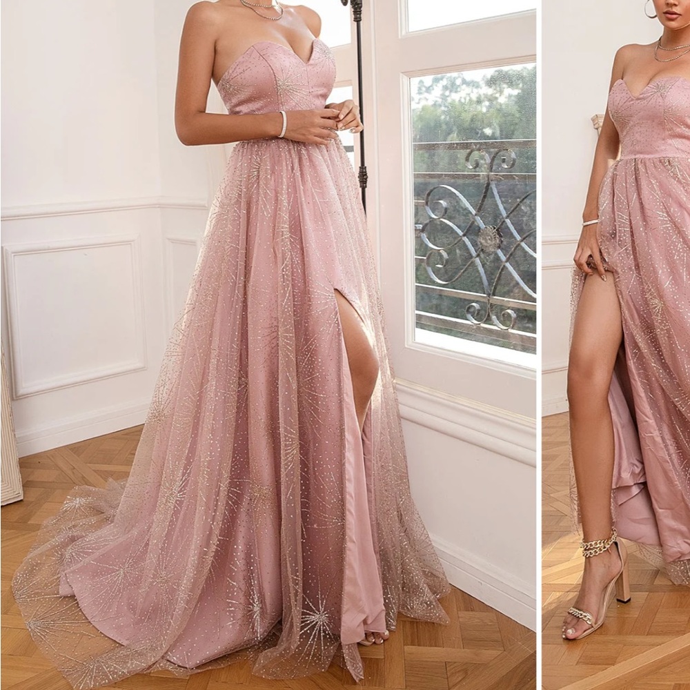 Model wearing a floor-length blush pink glittered evening gown with a high slit