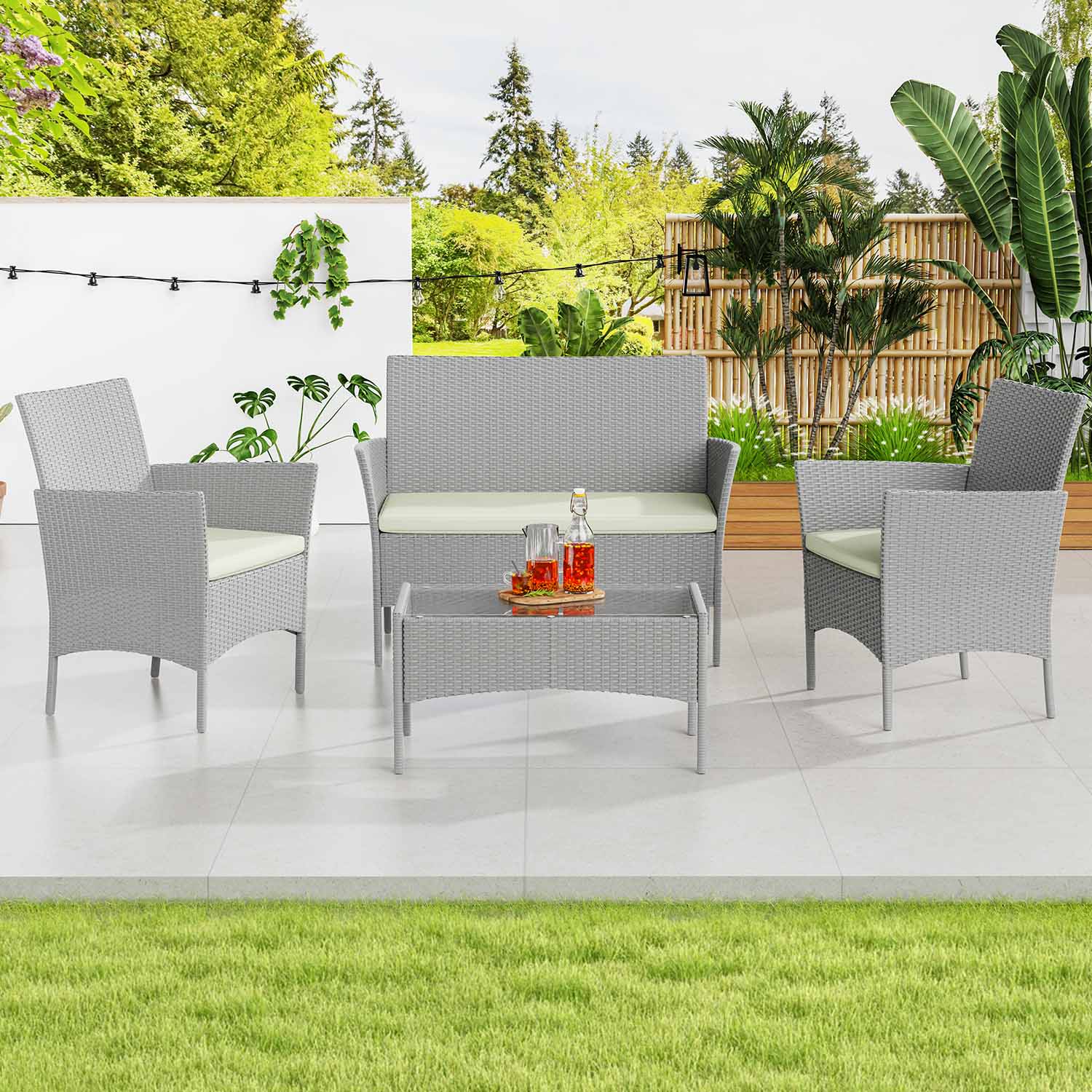 RattanTree outdoor rattan sofa, chairs and table on a garden patio