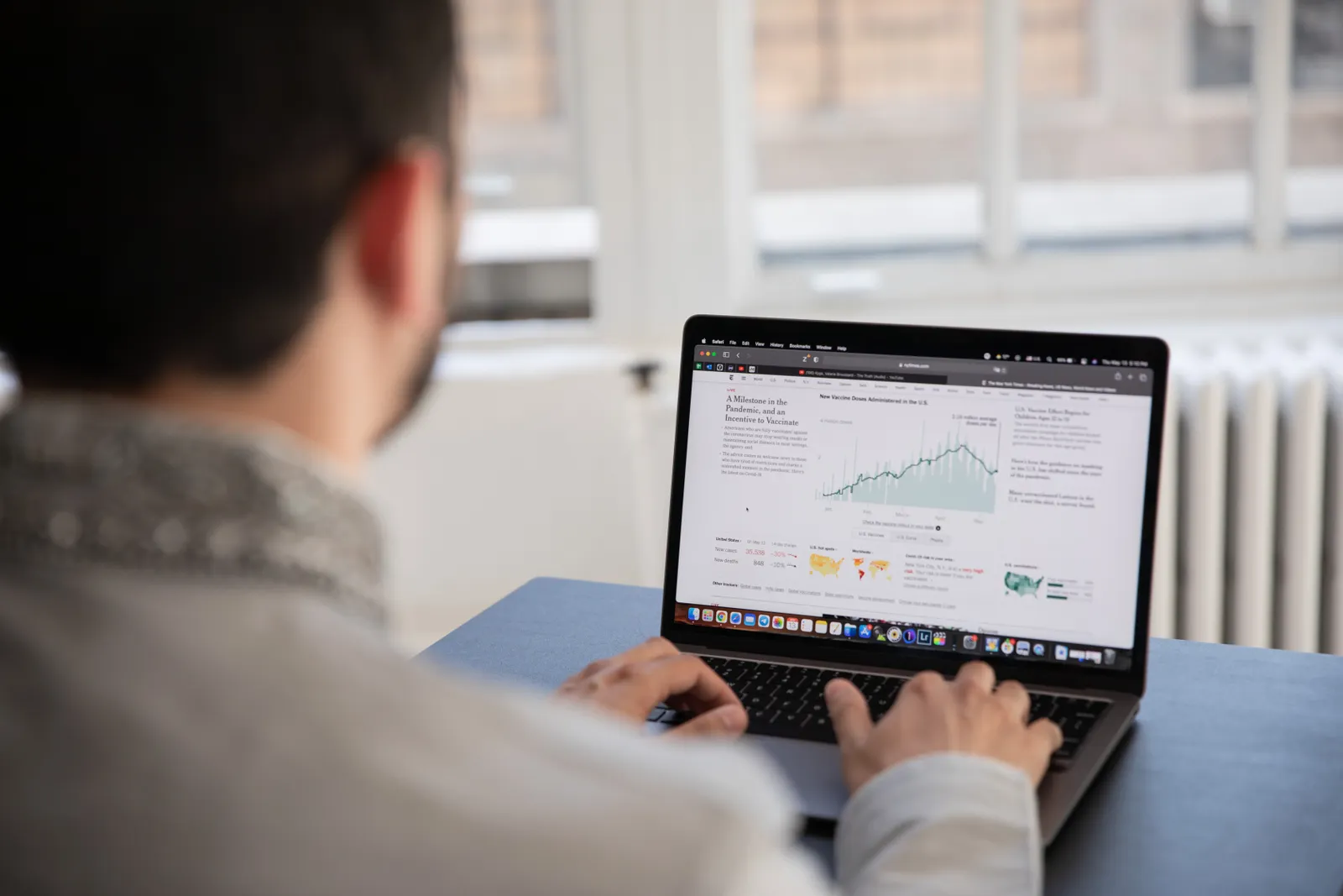 Person analyzing data on a laptop