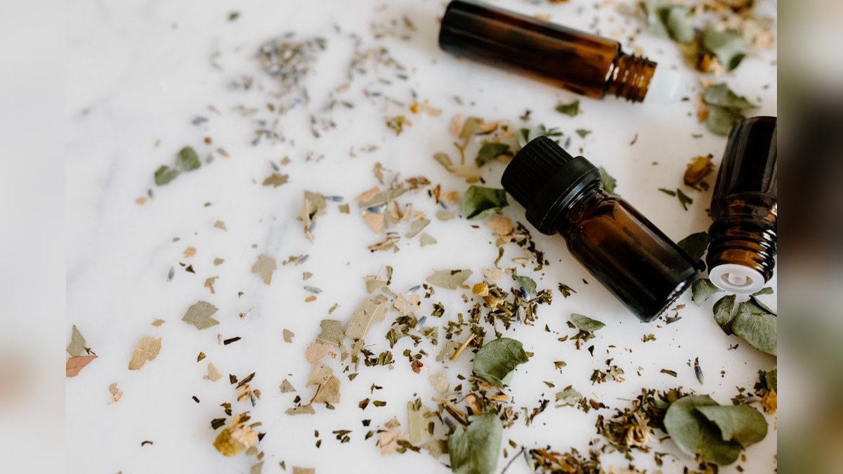Illustrative stock photograph of herbal oil bottles; not a product photograph